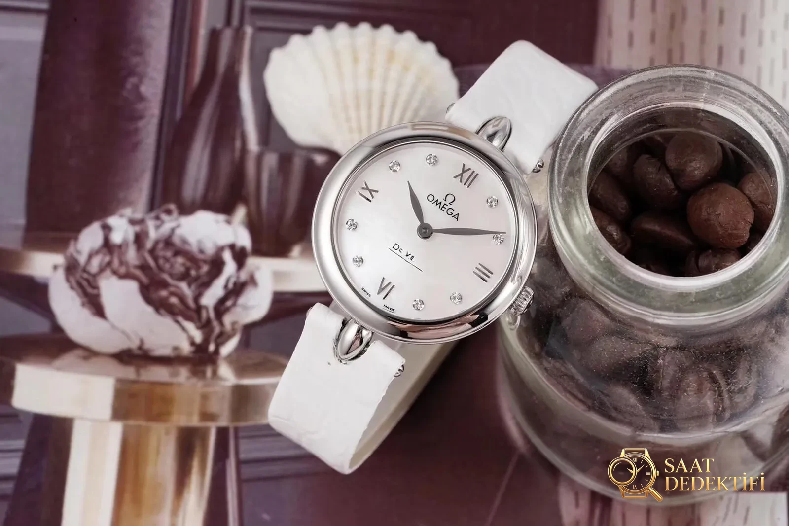 Gerçek-replika karşılaştırması: GS Factory Omega De Ville serisi 424.13.27.60.55.001 replika kadın kol saati 27.4 mm İsviçre menşeli kuvars - Kadran Detayı ve Bezel İşçiliği