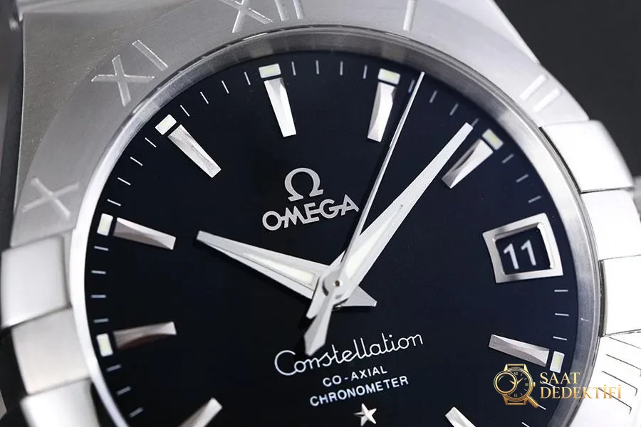 VS Factory Omega Constellation Serisi 123.10.38.21.01.001 Replika Kol Saati - 38 mm Model - Kasa Profili ve Kurma Kolu İncelemesi